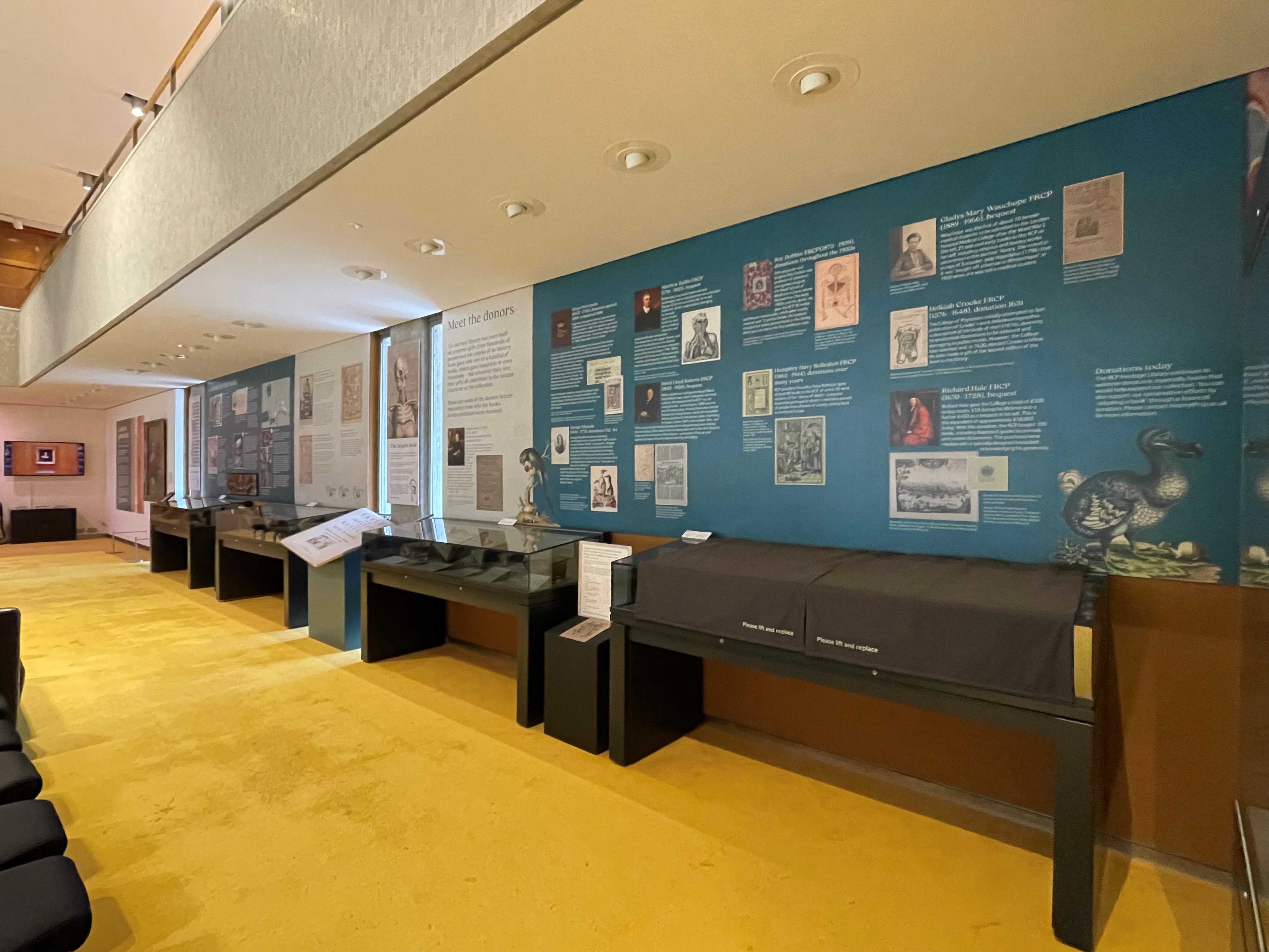 The exhibition gallery showing a board with information on donors to the library,