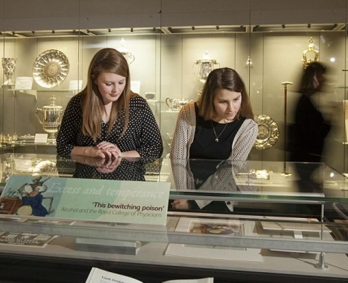 People looking at a display case